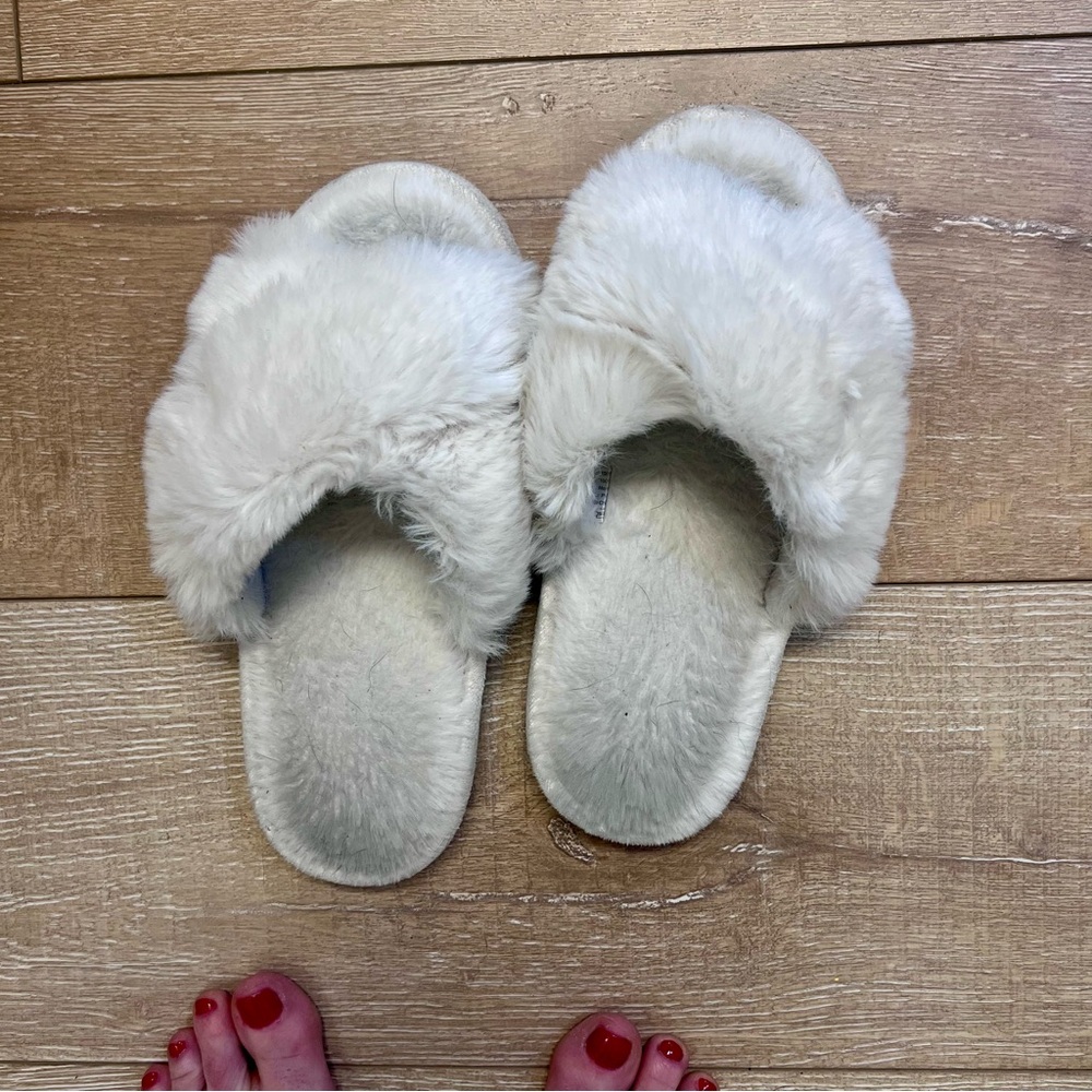 Well Loved. Women’s Slippers with normal wear. 
Fluffy White Slippers